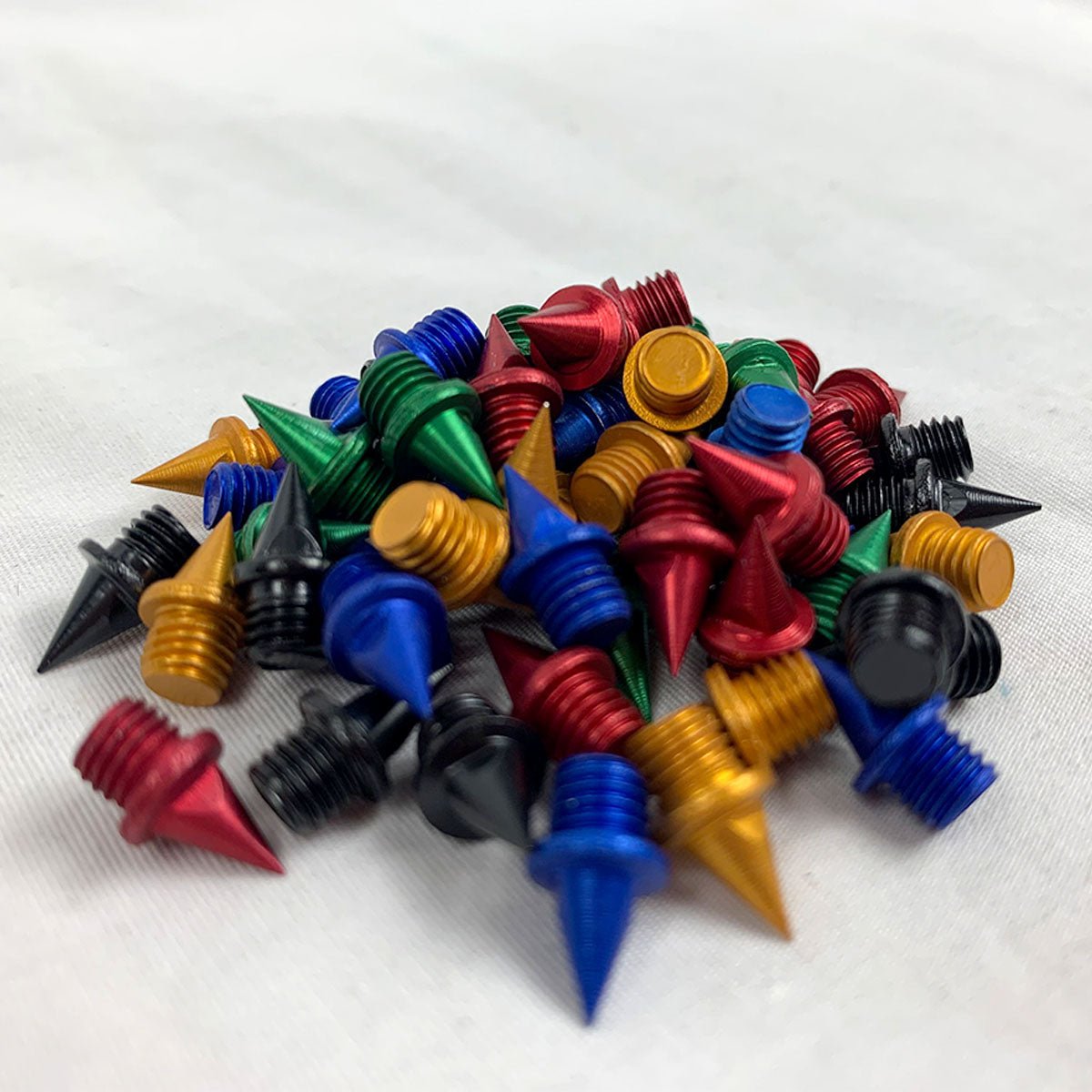 COLORED CARBON PYRAMID SPIKES - TrackBarn